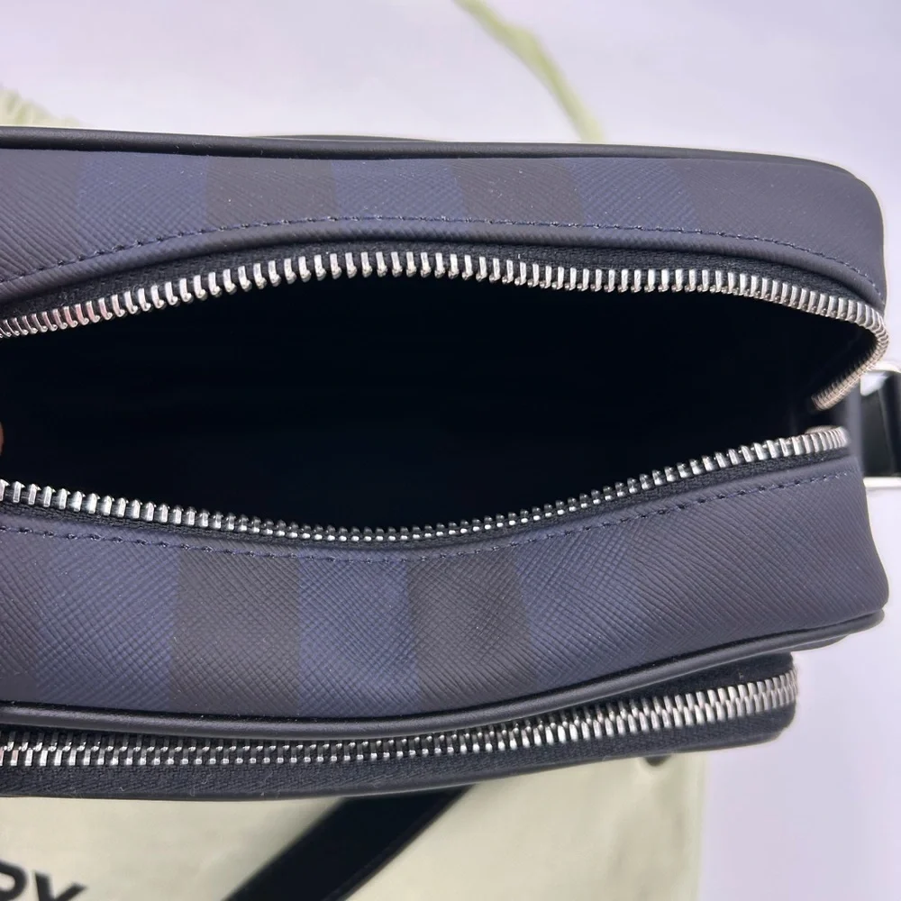 Men's Burberry, check messenger bag in navy blue. Adjustable shoulder strap.